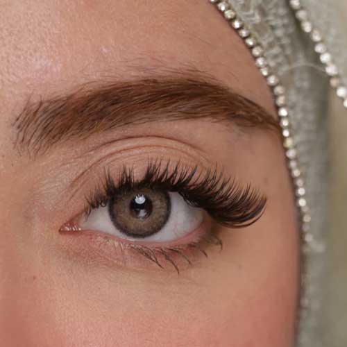 لنز چشم شیشه‌ای هرا مدل 15 سالانه کد AQYA320 رنگ عسلی طوسی طبیعی دور دار